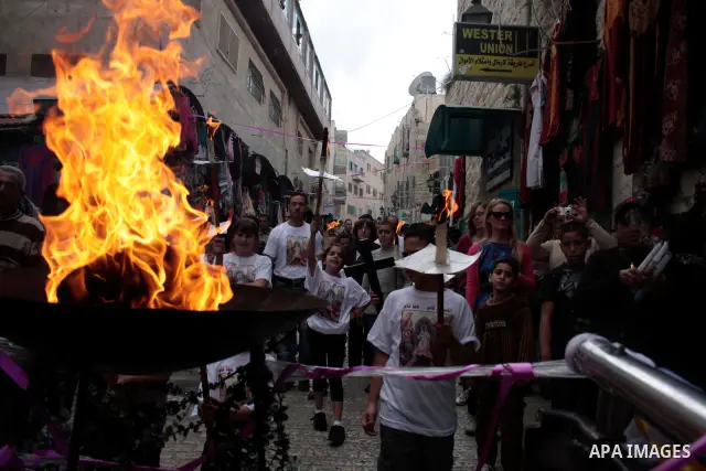 Christian Greek Orthodox take part in the 'Holy Fire' ceremony on the eve of the Orthodox Easter in the West Bank town of Bethlehem on April 23, 2011. Photo by Najeh Hashlamoun