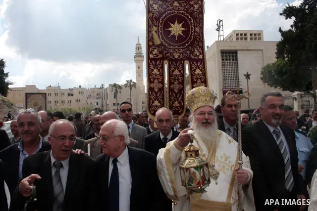 Christian Greek Orthodox take part in the 'Holy Fire' ceremony on the eve of the Orthodox Easter in the West Bank town of Bethlehem on April 23, 2011. Photo by Najeh Hashlamoun