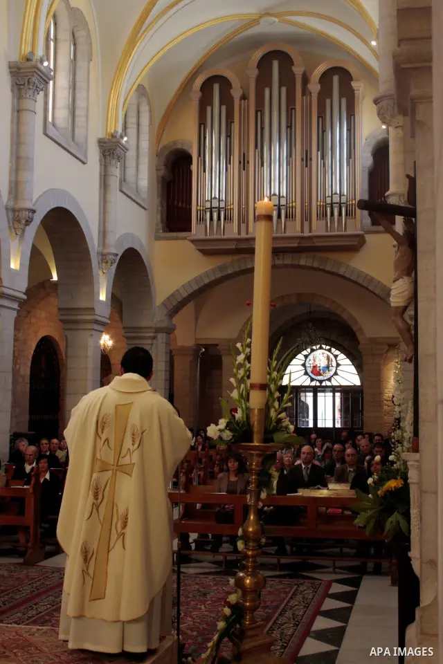 Palestinian worshippers take part in a prayer and march at the Church of St. Catherine, which is connected to the Church of the Nativity, in the West Bank town of Bethlehem, April 24, 2011.The church is built over the gr...