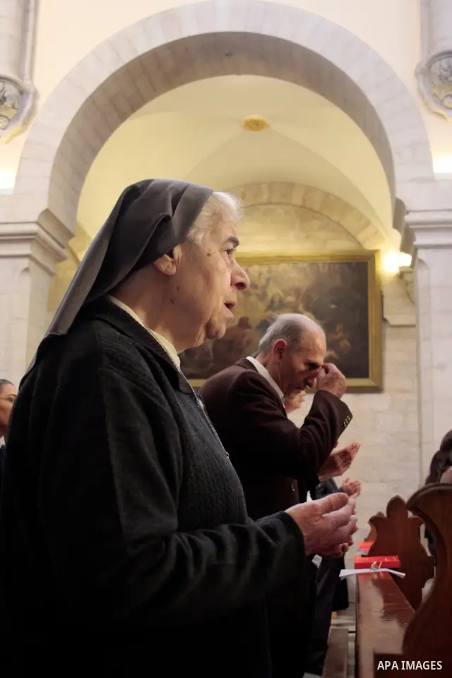 Roman Catholic nuns pray in the Sunday prayer in Saint Catherine in the complex of the Church of the Nativity in the biblical West Bank town of Bethlehem April 24 2011.Photo by Najeh Hashlamoun..