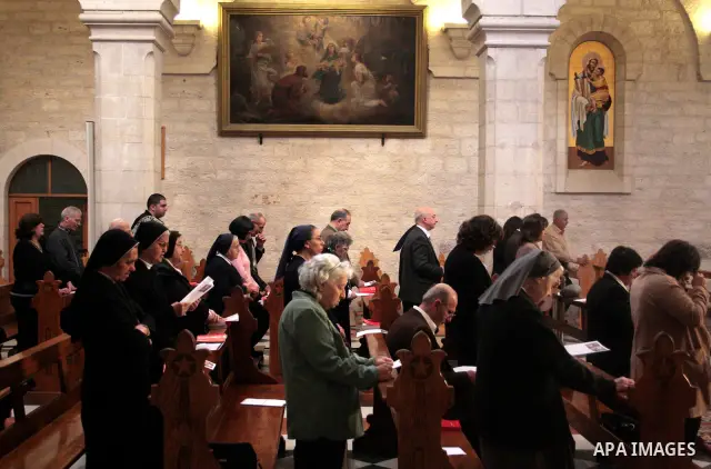 Roman Catholic nuns pray in the Sunday prayer in Saint Catherine in the complex of the Church of the Nativity in the biblical West Bank town of Bethlehem April 24 2011.Photo by Najeh Hashlamoun..