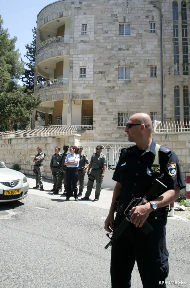 Israeli soldiers stand guard as Members of the Armenian community in Jerusalem rally outside the Turkish consulate in Jerusalem on April 24, 2011 to mark the 96th anniversary of mass killings of Armenians under the Ottom...