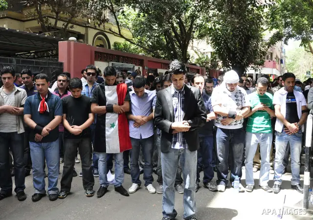 Syrians living in Egypt demonstrate against the recent actions of the Syrian government and in support of protesters, outside the Syrian Embassy on April 26, 2011. Syrian army units deployed in the city of Deraa which ha...