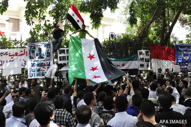 Syrians living in Egypt demonstrate against the recent actions of the Syrian government and in support of protesters, outside the Syrian Embassy on April 26, 2011. Syrian army units deployed in the city of Deraa which ha...