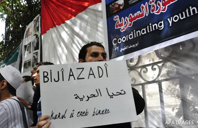 Syrians living in Egypt demonstrate against the recent actions of the Syrian government and in support of protesters, outside the Syrian Embassy on April 26, 2011. Syrian army units deployed in the city of Deraa which ha...