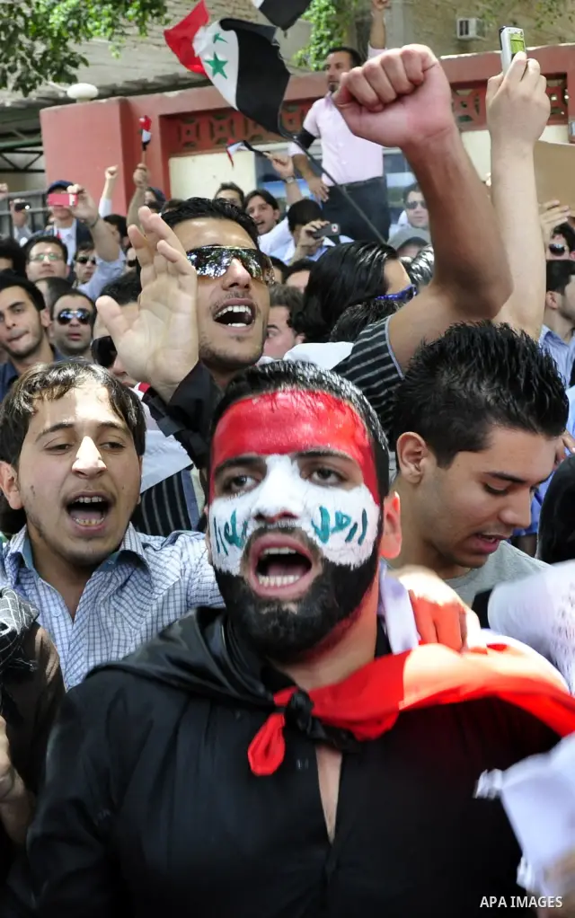 Syrians living in Egypt demonstrate against the recent actions of the Syrian government and in support of protesters, outside the Syrian Embassy on April 26, 2011. Syrian army units deployed in the city of Deraa which ha...