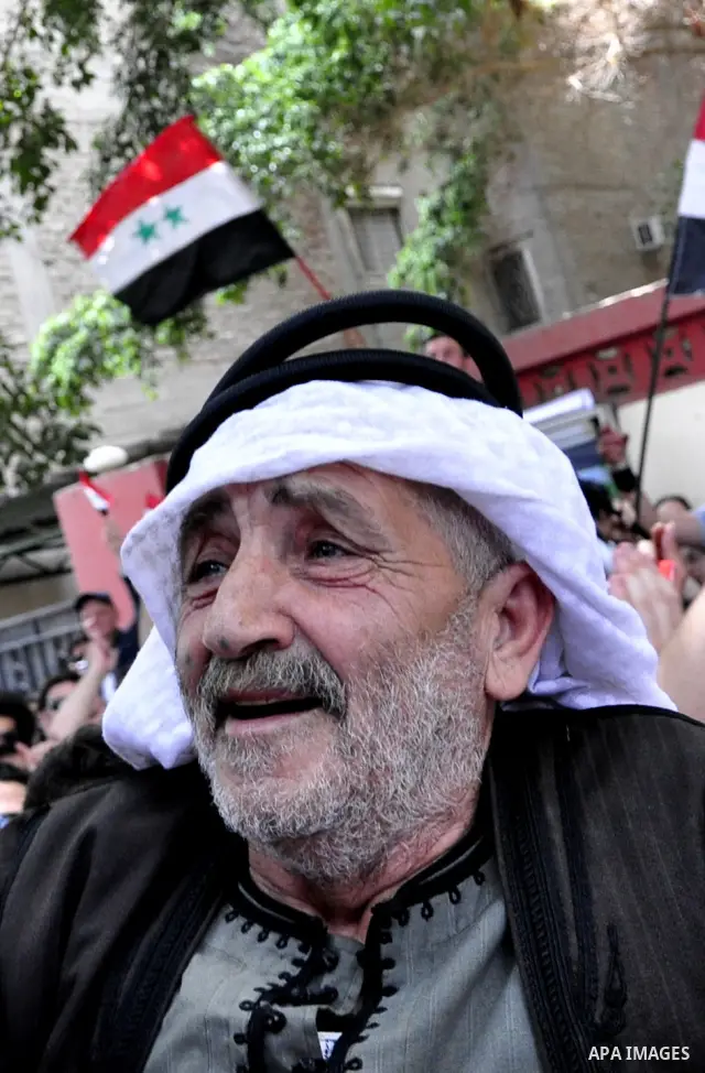 Syrians living in Egypt demonstrate against the recent actions of the Syrian government and in support of protesters, outside the Syrian Embassy on April 26, 2011. Syrian army units deployed in the city of Deraa which ha...
