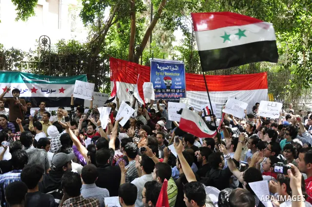 Syrians living in Egypt demonstrate against the recent actions of the Syrian government and in support of protesters, outside the Syrian Embassy on April 26, 2011. Syrian army units deployed in the city of Deraa which ha...