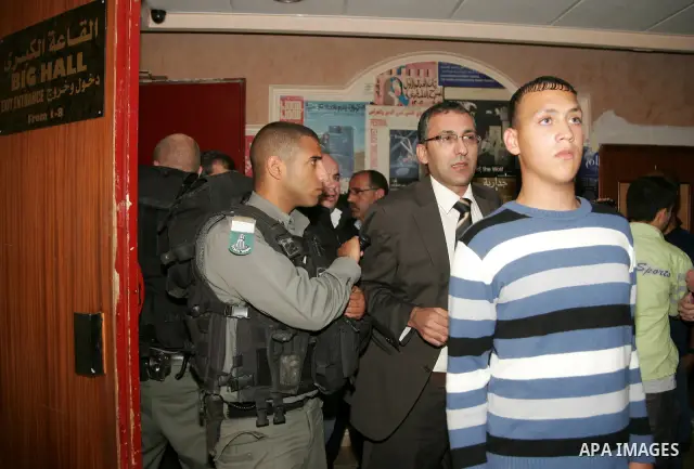 Israeli border officers scuffle with Palestinians at the Palestinian National Theatre in East Jerusalem on April 26,2011. Photo by Mahfouz Abu Turk