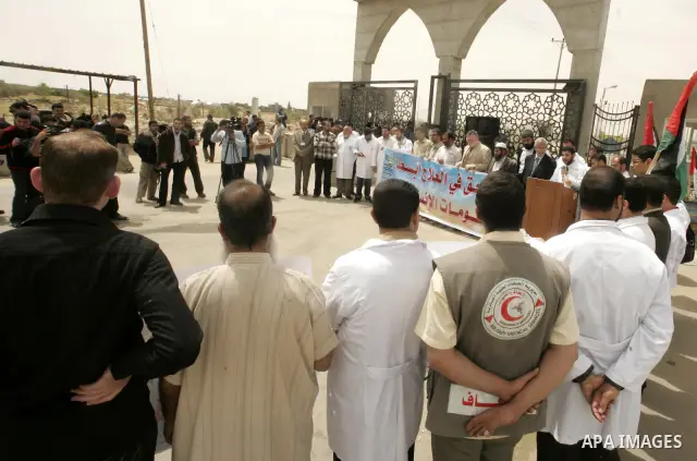 Palestinian doctors protest in front of the Rafah crossing border between Egypt and Gaza Strip on April ,27,2011, calling the new Egyptian government to open the crossing border for entering the medical needs. Photo by A...