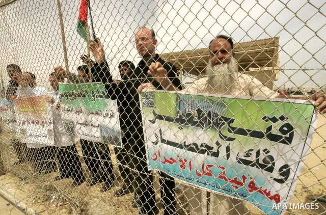 Palestinian doctors protest in front of the Rafah crossing border between Egypt and Gaza Strip on April ,27,2011, calling the new Egyptian government to open the crossing border for entering the medical needs. Photo by A...