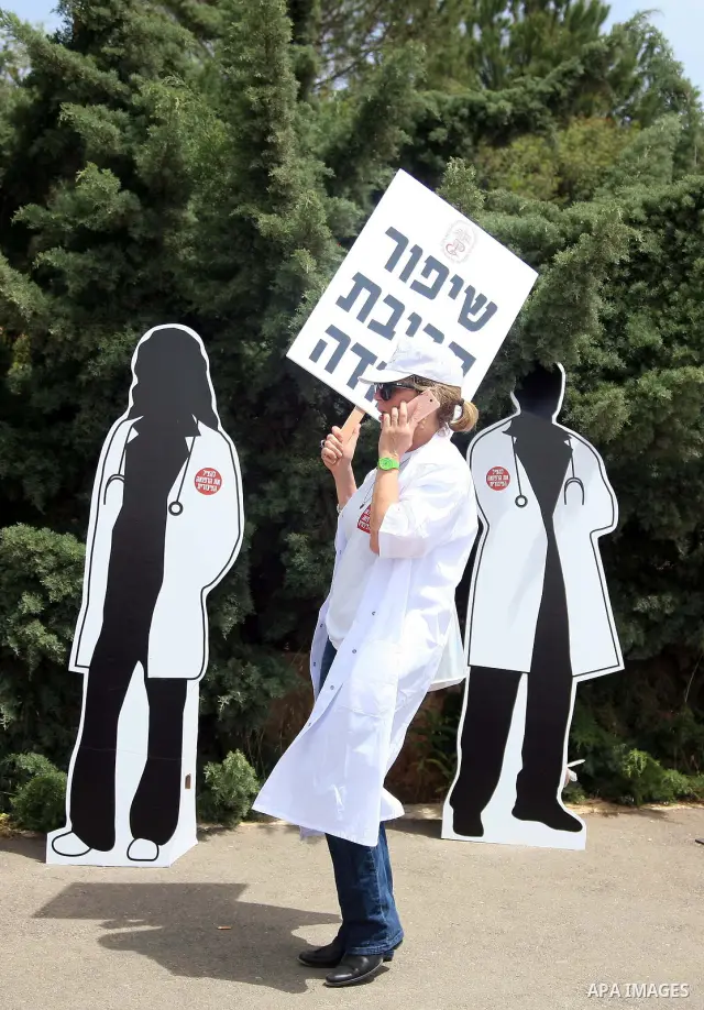 Doctors and medical students from all over Israel protest outside the Knesset in Jerusalem on April 27,2011 against the poor terms of their employment. Due to their strike surgeries that are not urgent will not be perfor...