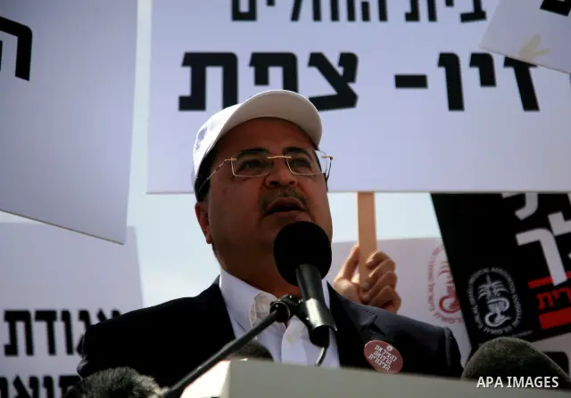 Arab MK Ahmad Tibi takes part in a protest held by doctors and medical students from all over Israel, outside the Knesset in Jerusalem on April 27,2011 against the poor terms of their employment. Due to their strike surg...