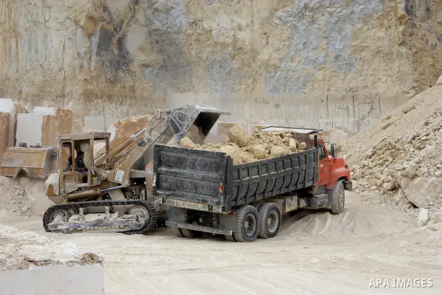 Palestinian labourers work at a quarry in the West Bank village of Taffouh near Hebron April 28, 2011. Stone and marble factories and quarries, located mainly in the West Bank cities of Bethlehem and Hebron, are at the c...