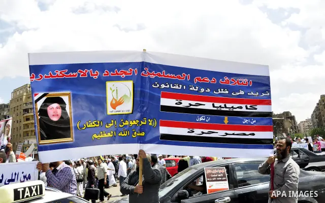 Salafists hold banners calling for the release of Kamilia Shehata, a Muslim woman who according to them is kept by the Coptic Church, during a protest in front of Al Nour mosque in Abbasiya, Cairo, Egypt, 29 April 2011....