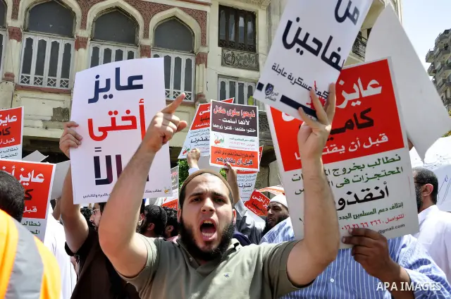 Salafists hold banners calling for the release of Kamilia Shehata, a Muslim woman who according to them is kept by the Coptic Church, during a protest in front of Al Nour mosque in Abbasiya, Cairo, Egypt, 29 April 2011....