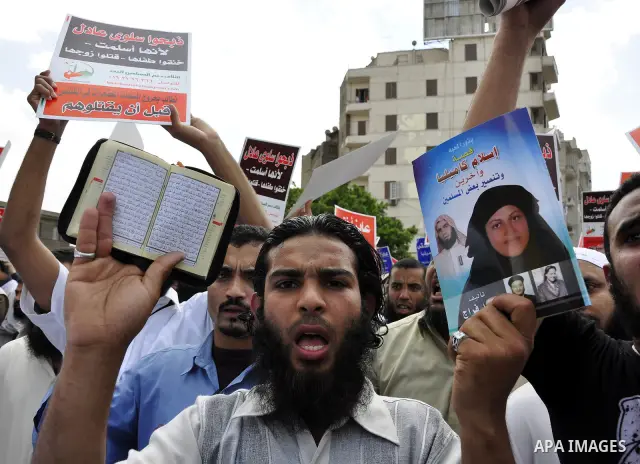 Salafists hold banners calling for the release of Kamilia Shehata, a Muslim woman who according to them is kept by the Coptic Church, during a protest in front of Al Nour mosque in Abbasiya, Cairo, Egypt, 29 April 2011....