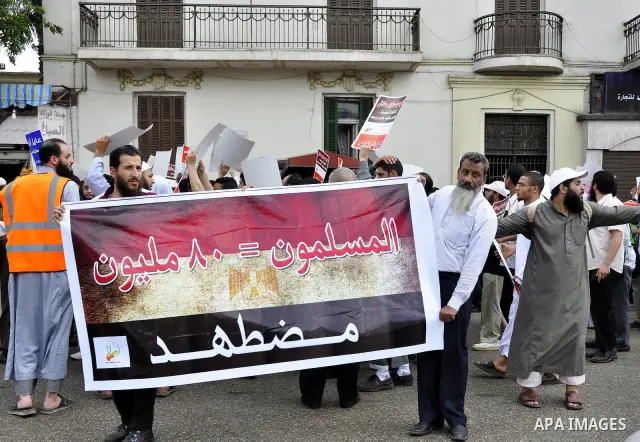 Salafists hold banners calling for the release of Kamilia Shehata, a Muslim woman who according to them is kept by the Coptic Church, during a protest in front of Al Nour mosque in Abbasiya, Cairo, Egypt, 29 April 2011....