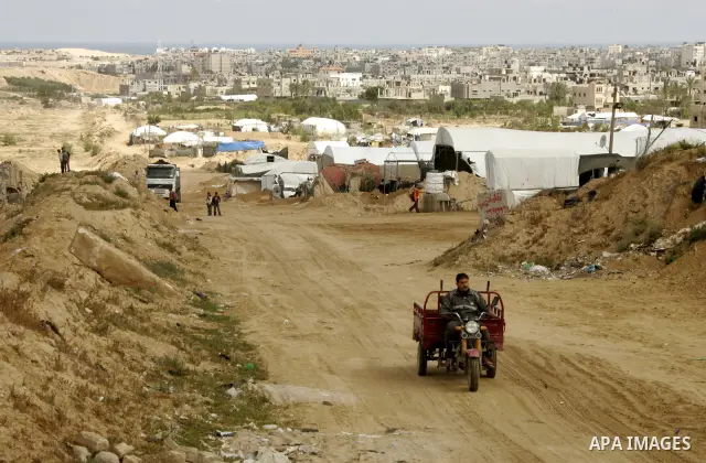 Palestinian boys walk near Rafah close to the border between Egypt and the southern Gaza Strip on April 30, 2011, a day after Egypt said it will permanently open the Rafah border crossing as part of its plans to ease the...
