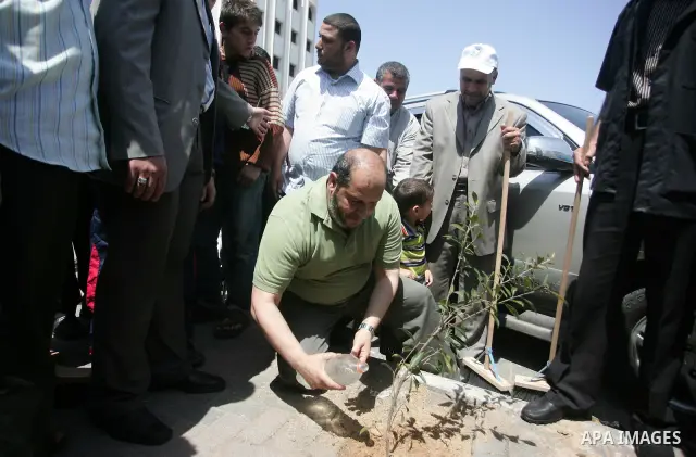 Palestinian Hamas leader, Khaleel Al-Hayia Participate in cleaning streets and planting olive trees during a campaign organized by Hamas in Gaza City on May 1, 2011. Photo by Mohammed Othman