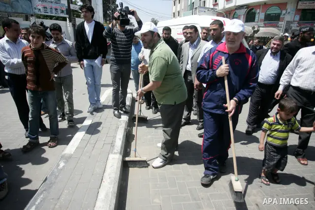 Palestinian Hamas leader, Khaleel Al-Hayia Participate in cleaning streets and planting olive trees during a campaign organized by Hamas in Gaza City on May 1, 2011. Photo by Mohammed Othman