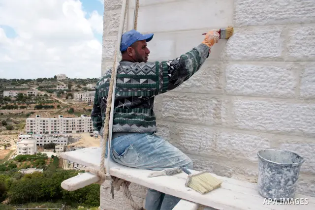 A labour works as Palestinians marking workers' May Day in the West Bank city of Hebron on May 01, 2011.Photo by Najeh Hashlamoun