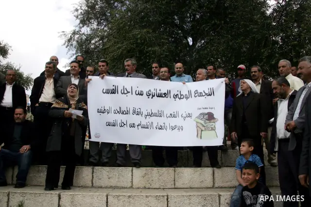 Palestinians residents of Jerusalem demonstrate at the Damascus Gate outside Jerusalem's old city on May 1, 2011, as they welcome reports that rival political movements the secularist Fatah and radical Islamist Hamas fac...