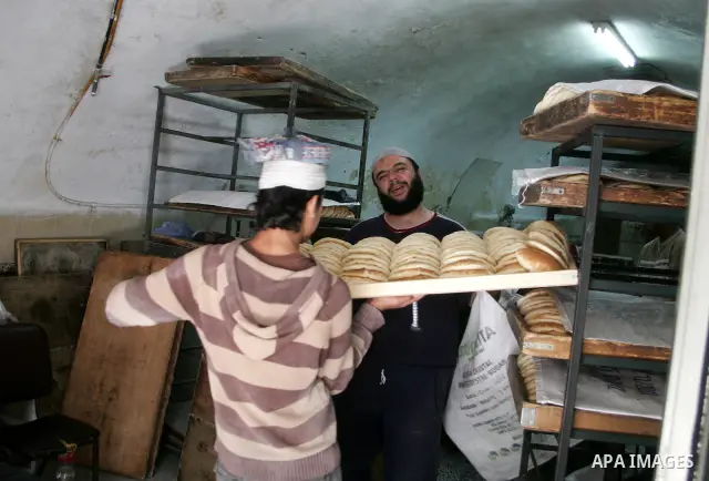 A labour works at bakery as Palestinians marking workers' May Day in Jerusalem's old city on May 01, 2011.Photo by Mahfouz Abu Turk