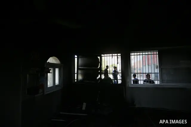 Palestinians inspect a mosque, situated inside a school, which was allegedly burnt by Israeli settlers in the West Bank village of Hawara, south of Nablus, on May 03, 2011 as Israeli police arrested a group of Israeli ci...