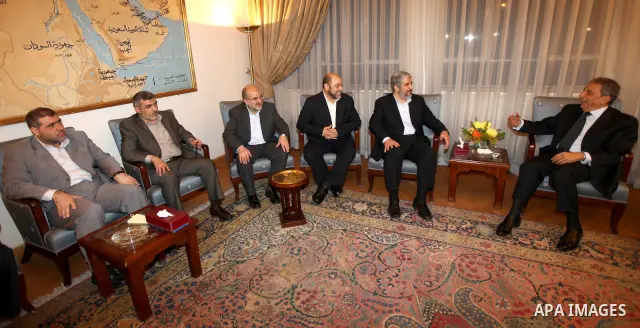Arab League General Secretary Amr Mussa meets with Senior Hamas Leader Khaled Mashaal and senior Hamas members in Cairo on May 3, 2011. Palestinian factions signed a reconciliation deal in Cairo to end the divide between...