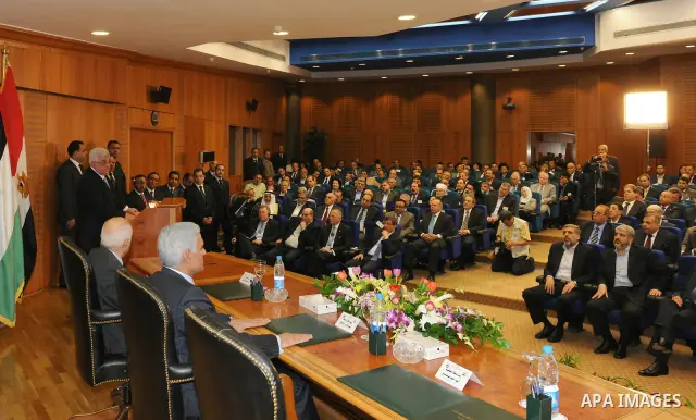 Palestinian President Mahmoud Abbas (Abu Mazen) attends the signing of reconciliation agreement in Cairo, Egypt on May 4,2011. Fatah and Hamas officials lead a ceremony celebrating the signing of a reconciliation deal in...