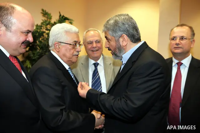 Palestinian President Mahmoud Abbas (Abu Mazen) meets with Senior Hamas leader Khaled Mashaal in Cairo, Egypt on May 4,2011. Fatah and Hamas officials lead a ceremony celebrating the signing of a reconciliation deal inte...