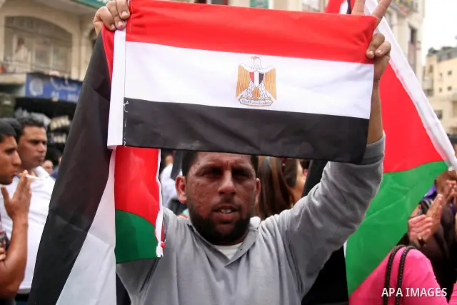 Palestinians celebrate during a rally in the West Bank city of Ramallah on May 04, 2011 as Palestinians in the West Bank and Gaza Strip gather to welcome a reconciliation deal signed by rival movements Hamas and Fatah in...