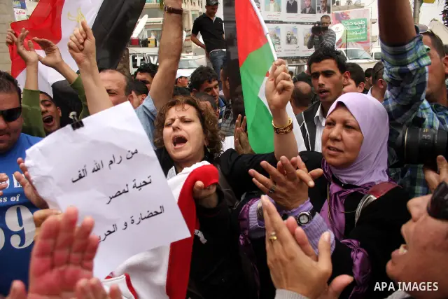Palestinians celebrate during a rally in the West Bank city of Ramallah on May 04, 2011 as Palestinians in the West Bank and Gaza Strip gather to welcome a reconciliation deal signed by rival movements Hamas and Fatah in...