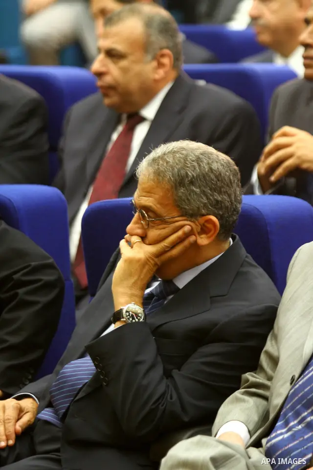 Arab League secretary general Amr Mussa attends a reconciliation ceremony between the Fatah party and the Hamas movement in the Egyptian capital Cairo on May 4, 2011. Fatah and Hamas officials lead a ceremony celebrating...