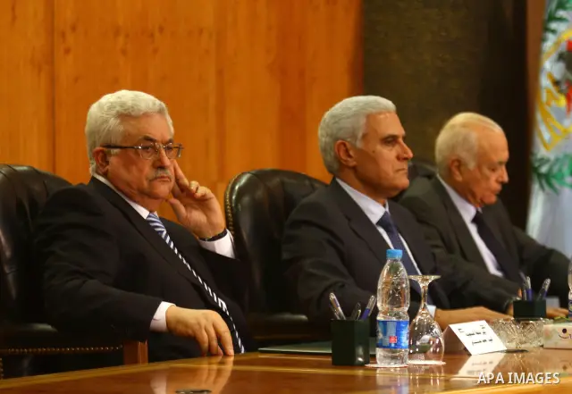 Palestinian president Mahmud Abbas, Egyptian intelligence chief General Murad Muafi and Egyptian Foreign Minister Nabil al-Arabi attend a reconciliation ceremony between the Fatah party and the Hamas movement in the Egyp...