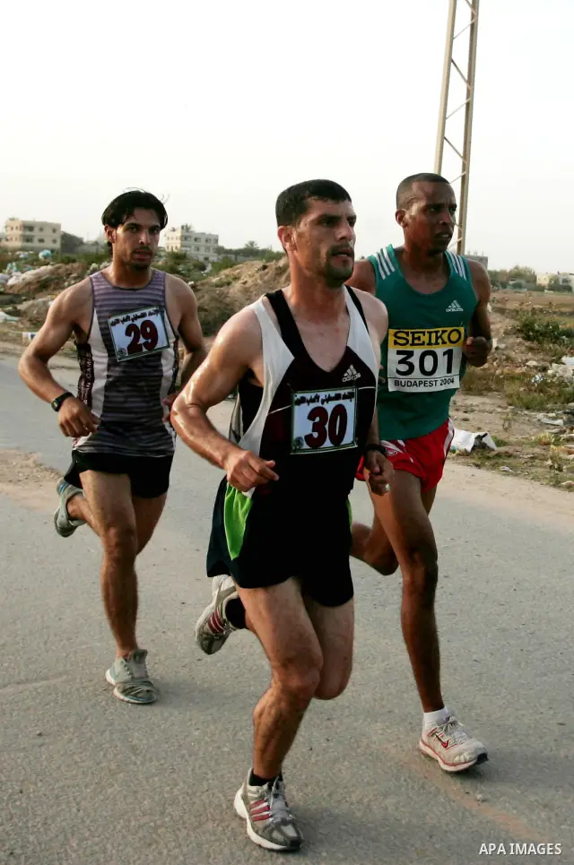 Palestinian racers speed along the waterfront in Gaza City on May 5, 2011 as he competes in the Gaza Strip's first-ever marathon which runs the entire length of the coastal enclave. Photo by Mohammed Othman