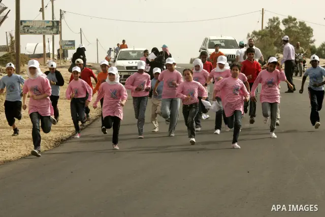 Palestinian and foreign participants run in Rafah town in the southern Gaza Strip on May 5, 2011 as they compete in the Gaza Strip's first-ever marathon which runs the entire length of the coastal enclave. Photo by Abed...