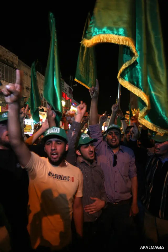 Palestinian Hamas supporters rally in the streets of the West Bank city of Nablus to celebrate on May 5, 2011 the political unity reconciliation deal between the Islamic group and the Fatah movement which was signed by t...