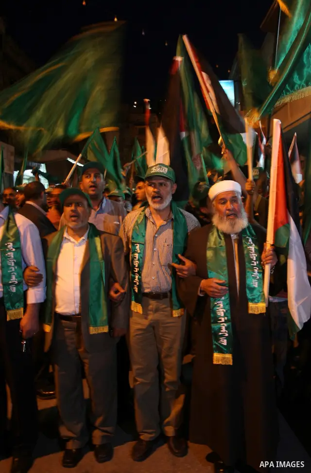 Palestinian Hamas supporters rally in the streets of the West Bank city of Nablus to celebrate on May 5, 2011 the political unity reconciliation deal between the Islamic group and the Fatah movement which was signed by t...
