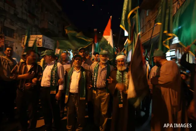 Palestinian Hamas supporters rally in the streets of the West Bank city of Nablus to celebrate on May 5, 2011 the political unity reconciliation deal between the Islamic group and the Fatah movement which was signed by t...