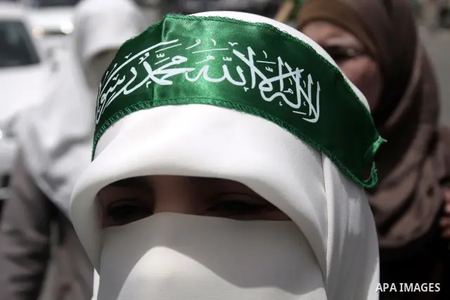 Palestinian Hamas supporters rally in the streets of the West Bank city of Hebron to celebrate on May 6, 2011 the political unity reconciliation deal between the Islamic group and the Fatah movement which was signed by t...