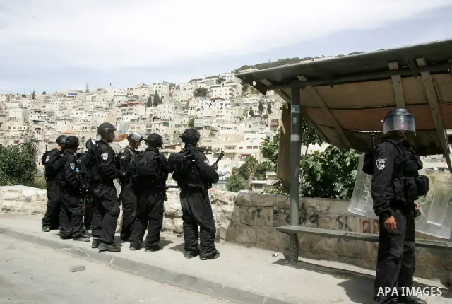 Israeli soldiers stand guard during clashes with Palestinian stone-throwers in the flashpoint east Jerusalem neighbourhood of Silwan on May 6,2011. Photo by Mahfouz Abu Turk