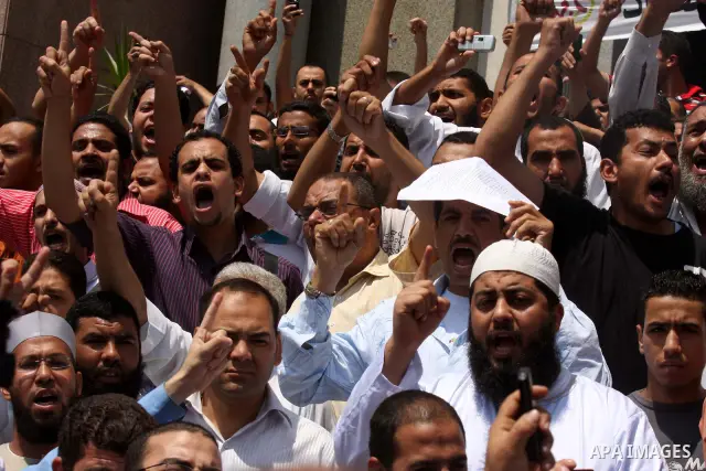 Egyptian Islamists shout slogans during a march to the US embassy after the weekly Friday prayer in Cairo on May 6, 2011, during a demonstration to denounce the killing of Osama bin Laden by US forces in Pakistan. Photo...