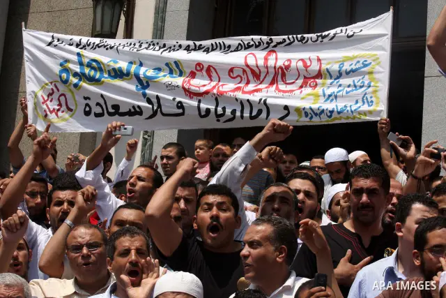 Egyptian Islamists shout slogans during a march to the US embassy after the weekly Friday prayer in Cairo on May 6, 2011, during a demonstration to denounce the killing of Osama bin Laden by US forces in Pakistan. Photo...