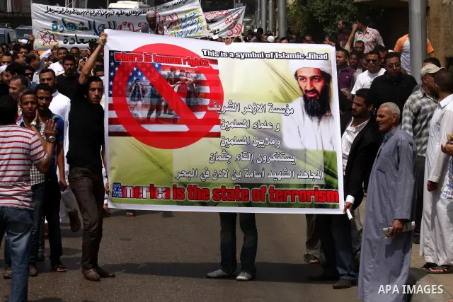 Egyptian Islamists, carrying a picture of late Al-Qaeda chief Osama bin Laden, march to the US embassy after the weekly Friday prayer in Cairo on May 6, 2011, during a demonstration to denounce the killing of Osama bin L...