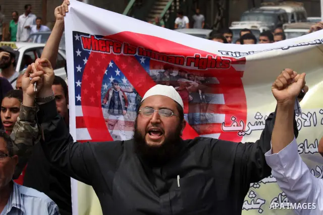 Egyptian Islamists shout slogans during a march to the US embassy after the weekly Friday prayer in Cairo on May 6, 2011, during a demonstration to denounce the killing of Osama bin Laden by US forces in Pakistan. Photo...