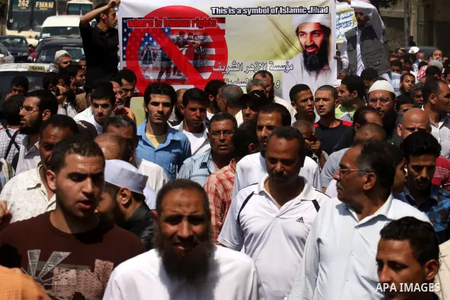 Egyptian Islamists, carrying a picture of late Al-Qaeda chief Osama bin Laden, march to the US embassy after the weekly Friday prayer in Cairo on May 6, 2011, during a demonstration to denounce the killing of Osama bin L...