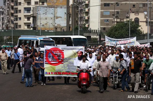 Egyptian Islamists, carrying a picture of late Al-Qaeda chief Osama bin Laden, march to the US embassy after the weekly Friday prayer in Cairo on May 6, 2011, during a demonstration to denounce the killing of Osama bin L...