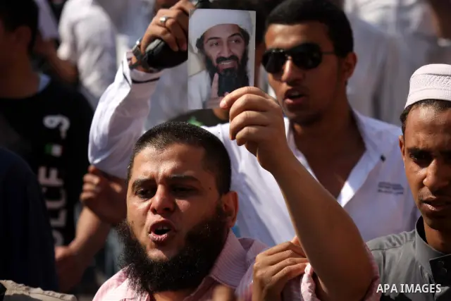 Egyptian Islamists, carrying a picture of late Al-Qaeda chief Osama bin Laden, march to the US embassy after the weekly Friday prayer in Cairo on May 6, 2011, during a demonstration to denounce the killing of Osama bin L...